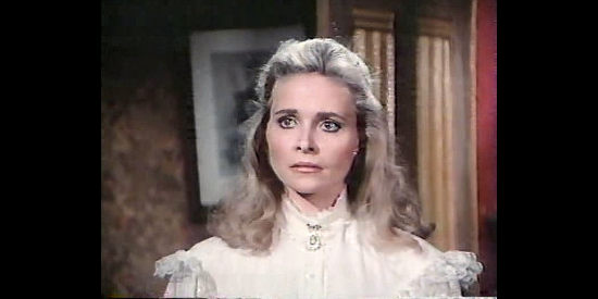 Priscilla Barnes as Maggie McCulloch, learning the truth about what to expect from Col. Isaacs in The Wild Women of Chastity Gap (1983)