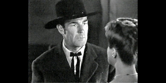 Randolph Scott as Sheriff Mark Rowley, trying to convince Henryetta of his innocence in Badman's Territory (1946)