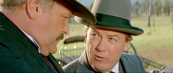 Rhys McConnochie as Mr. Patton, a banker plotting financing and their children's future with Hamilton in Return to Snowy River (1988)