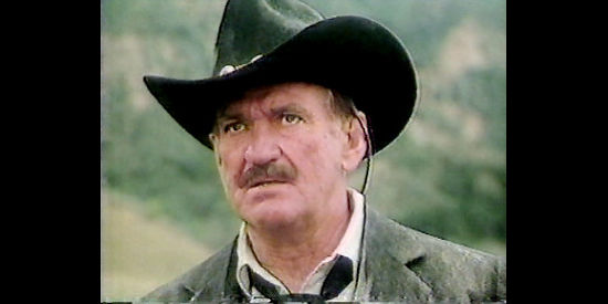 Rod Taylor as John Grail in Outlaws (1986)