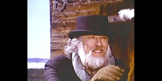 Ronald Haines as Shannon Wilson Bell, explaining his search for gold to other travelers in The Legend of Alfred Packer (1980)