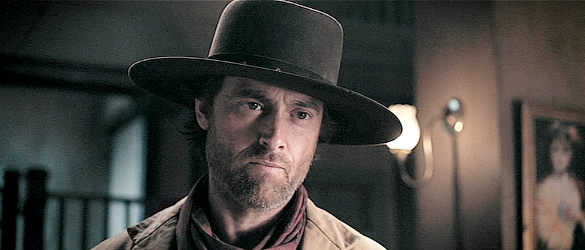 Stuart Townsend as Jericho Ford, visiting Longfellow's Saloon looking for answers in Apache Junction (2021)