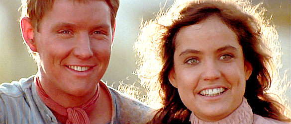 Tom Burlinson as Jim Craig and Sigrid Thornton as Jessica Harrison, watching her father's prized colt in The Man from Snowy River (1982)