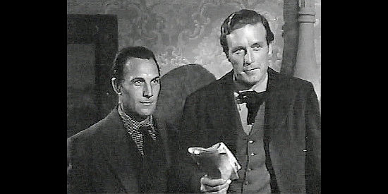 Tom Tyler as Frank James and Lawrence Tierney as Jesse, meeting the lady newspaper editor in Badman's Territory (1946)