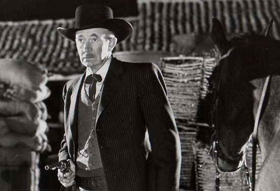Walter Brennan as Sheriff Bill Howard, determined to bring Delaney to justice in Surrender (1950)
