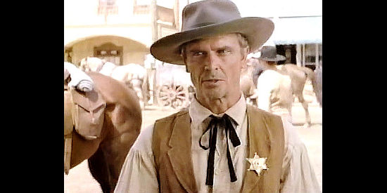 Wendell Smith as Sheriff Burrows, the lawman who does Turner's bidding in The Gunfighters (1987)