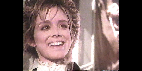 Whitney Kershaw as Miss Barnett, the young woman who would like to settle down with Custis Long if only he was the settling type in Longarm (1988)