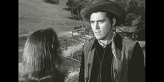 William Bishop as Larch Keegan, in a disagreement with the woman he hopes to marry in The Untamed Breed (1948)