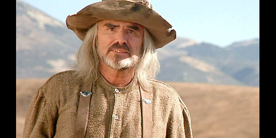 Burt Reynolds as Otter Bob, helping the Cherokee Kid improve his odds of surviving the West in The Cherokee Kid (1996)