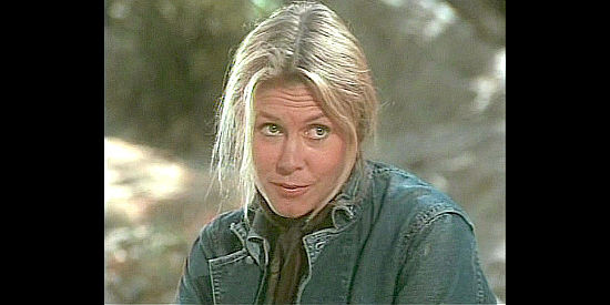 Elizabeth Montgomery as Etta Place, wondering why Jack Maddox is traveling with her, and why he doesn't bathe, in Mrs. Sundance (1974)
