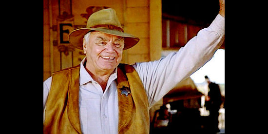 Ernest Borgnine as Sheriff Laughton, surprised to see the Taggarts return to Placerville in Outlaws, The Legend of O.B. Taggart (1995)