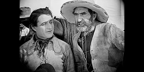 Ernest Torrence as William Jackson (right) with J. Warren Kerrigan as Will Banion in The Covered Wagon (1923)