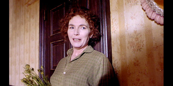 Fionnula Flanagan as Mrs. Hill, eager to see her daughter marry James Miller in Mad at the Moon (1992)