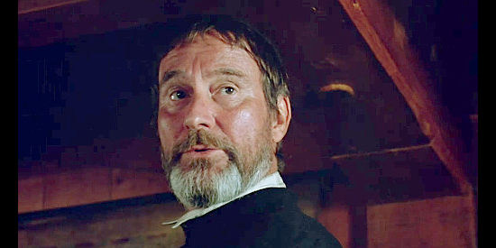 Francois Tasse as Father Bourgue, assuirng Champlain that Laforgue knows the danger he faces in Black Robe (1991)