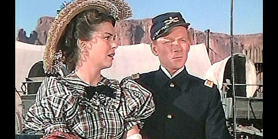 Joann Dru as Olivia Dandridge, preparing to go picnicking with Lt. Ross Pennell (Harry Carey Jr.) in She Wore a Yellow Ribbon (1949)