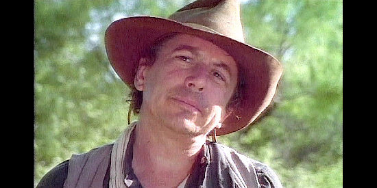 Joe Ely as rancher Dave Robertson, spotting a potentially ominous owl in Blood Trail (1997)