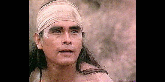 Joseph Runningfox as Geronimo, the young warrior facing down a Mexican soldier in Geronimo (1993)