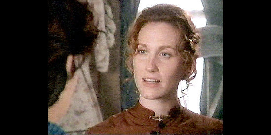 Judith Hoag as Sarah Lutz, Abbie's friend, suggesting they bring Ed Matthews to Buffalo Wallow in A Mother's Gift (1995)
