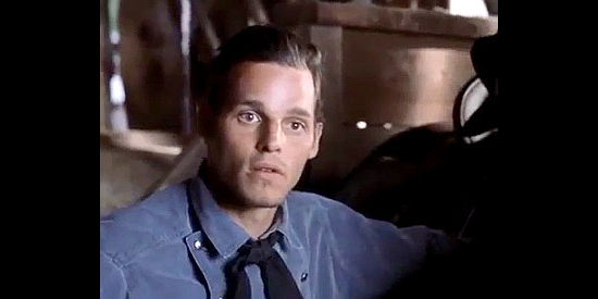 Justin Chambers as Cole Clayborne, explaing his Texas Ranger days to Mary Rose in Rose Hill (1997)