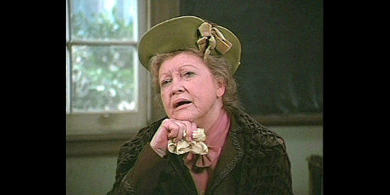 Lurene Tuttle as Mrs. Lee, wondering why an attractive young woman like Miss Johnson would settle in a small Western town in Mrs. Sundance (1974)