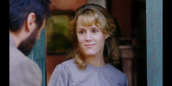 Mary Stuart Masterson as Jenny Hill welcomes her husband home under their new arrangement in Mad at the Moon (1992)