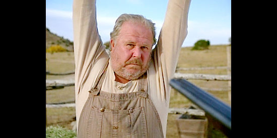 Ned Beatty as Sam Lawrence, under the gun of one of the Taggart boys in Outlaws, The Legend of O.B. Taggart (1995)
