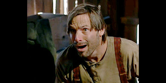 Nicholas Guest as Slocum Taggart, the simple-minded son O.B. wants to fix in Outlaws, The Legend of O.B. Taggart (1995)