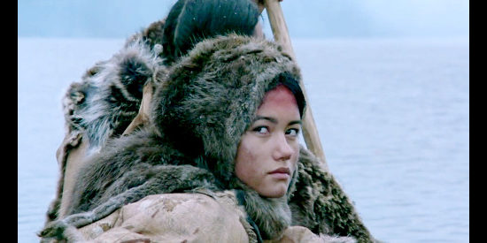 Sandrine Holt as Annuka, glancing back as the Algonquins leave the French behind in Black Rode (1991)