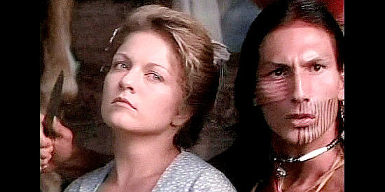 Sheryl Lee as Mary Ingles is taken captive at knifepoint by a Shawnee warrior in Follow the River (1995)