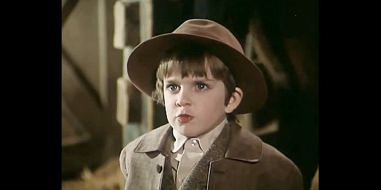 Sparky Marcus as Adam Spence, Will's young son, bullied because of his dad's past, in The Last Day (1975)