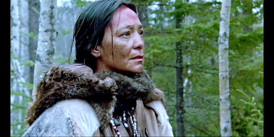Tantoo Cardinal as Chomina's wife, sensing trouble in the woods in Black Robe (1991)