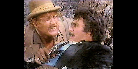 Taylor Lacher as Tulsa Red and Michael Delano as Blackjack Ketchum, pinned down in Desperate Women (1978)