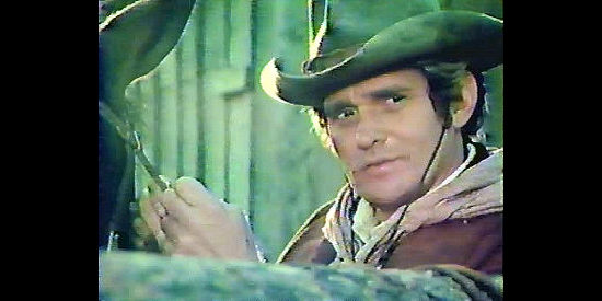 Bo Hopkins as George Dunning, a hired gun disgusted by the job he's been hired to do in The Invasion of Johnson County (1976)