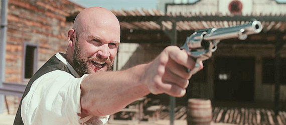 Chade Green as Brody Royal, ready to prove he's handy with a gun as well as his fists in Road to Revenge (2020)
