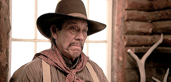 Danny Trejo as Junior, suggesting flight to 'old Mexico' in A Tale of Two Guns (2022)