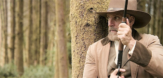 Ed Morrone as Artemis Hollinger, on the hunt for yet another outlaw in A Tale of Two Guns (2022)