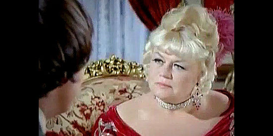 Eddra Gale as Lola, the madam who helps Manolito locate his long-lost uncle in New Lion of Sonora (1971)