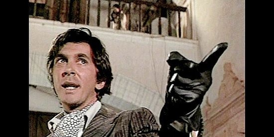 Frank Langella as Thomas De La Plata, warning Father Van Horne of the high price of holding mass in his town in The Wrath of God (1972)