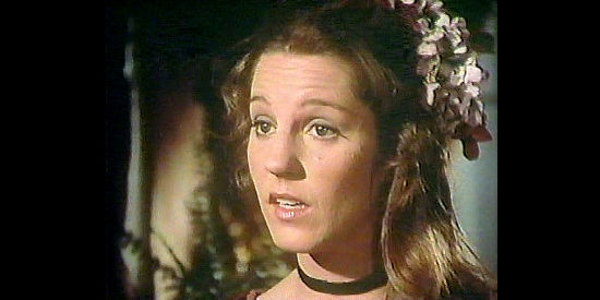 Georganne LaPiere as Lila, the prostitute whose murder is just the latest in a chain of such killing in Law of the Land (1976)