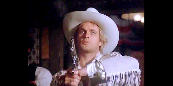 Jeff Osterhage as John Golden, showing off his six-gun skills in The Legend of the Golden Gun (1979)