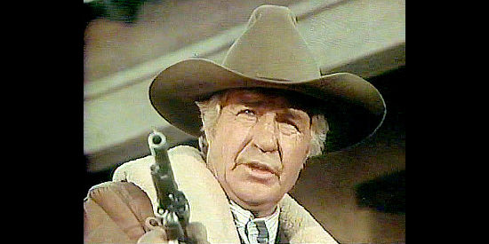 Jim Davis as Denver Sheriff Pat Lambrose, trying to solve the brutal murder of prostitutes in Law of the Land (1976)