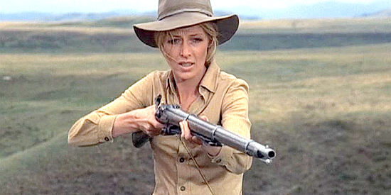 Joanna Pettet as Maggie Sergeant, taking aim at a cow trampling her wheat crop in Pioneer Woman (1973)