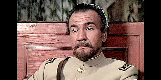 John Colicos as Col. Santilla, explaining the mission he wants the three men to carry out in The Wrath of God (1972)