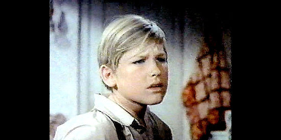 Kurt Russell as Jamie McPheeters, the youngster who accompanies Linc to town in Guns of Diablo (1964)