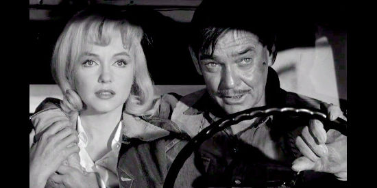 Marilyn Monroe as Roslyn Taber and Clark Gable as Gay Langland, wondering about the future in The Misfits (1961)