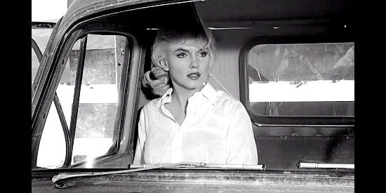 Marilyn Monroe as Roslyn Taber, watching in horror as the men rope and bring down the mustangs in The Misfits (1961)