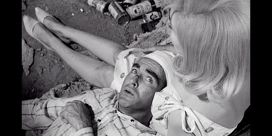 Montgomery Clift as Perce Howland finds a comfotable resting spot after being thrown by a bull in The Misfits (1961)