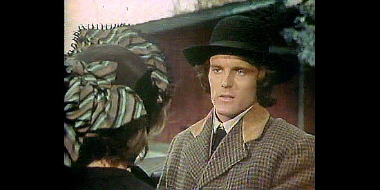 Nicholas Hammond as Brad Jenson, trying to keep the details of a horrific murder from his wife Selina in Law of the Land (1976)