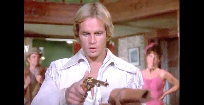 Jeff Osterhage as John Golden, admiring his new golden gun in The Legend of the Golden Gun (1979)