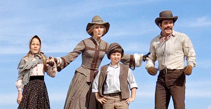 Joanna Pettet as Maggie Sergeant and William Shatner as husband John, celebrating their arrival in Wyoming with their children in Pioneer Woman (1973)